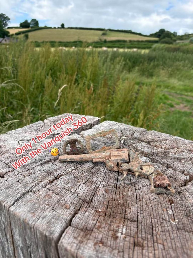kids tou gun, and a beautiful cap badge found whilst metal detecting using the minelab vanquish 360.