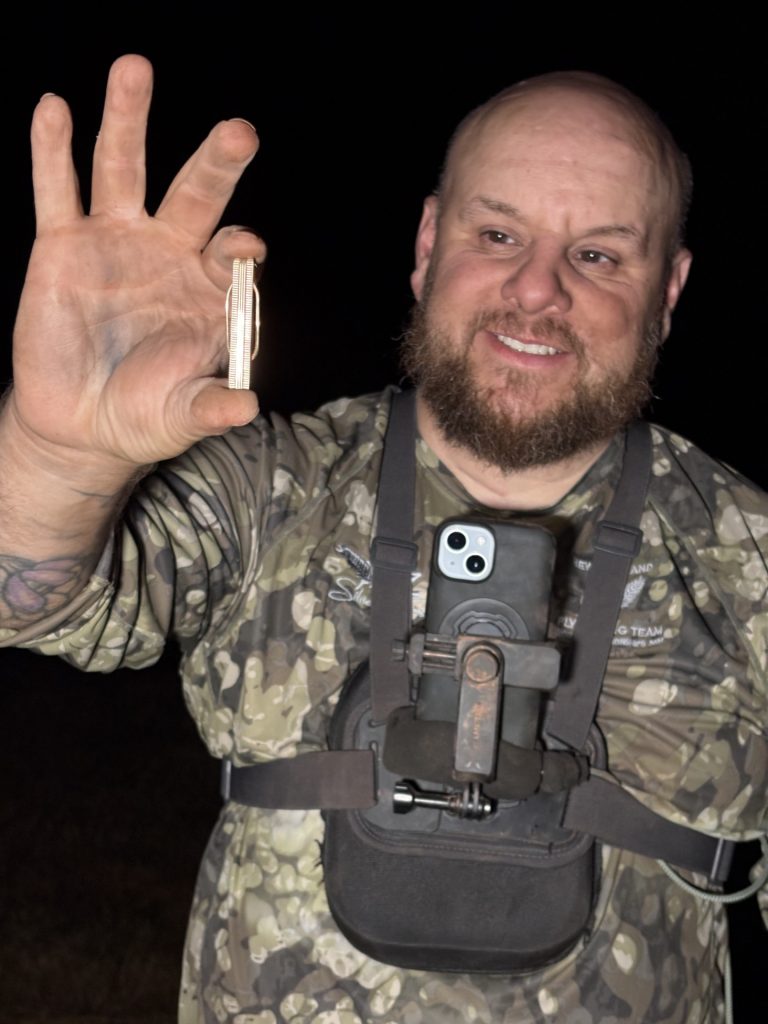 Terry holding a 9ct gold tie pin.
