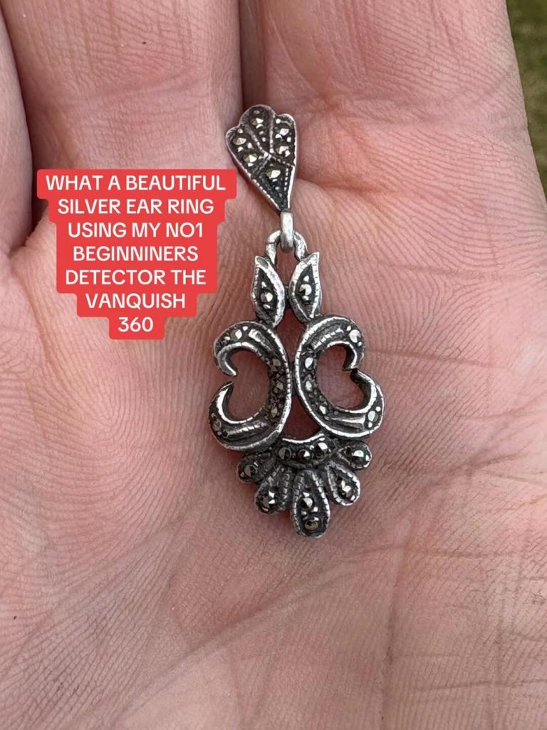 a silver earring found whilst metal detecting.