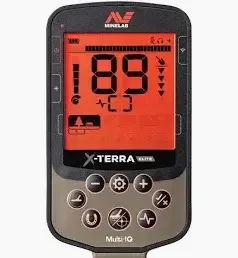 A digital display device showing a red screen with numerical readings and buttons of a minelab X-terra elite metal detector.