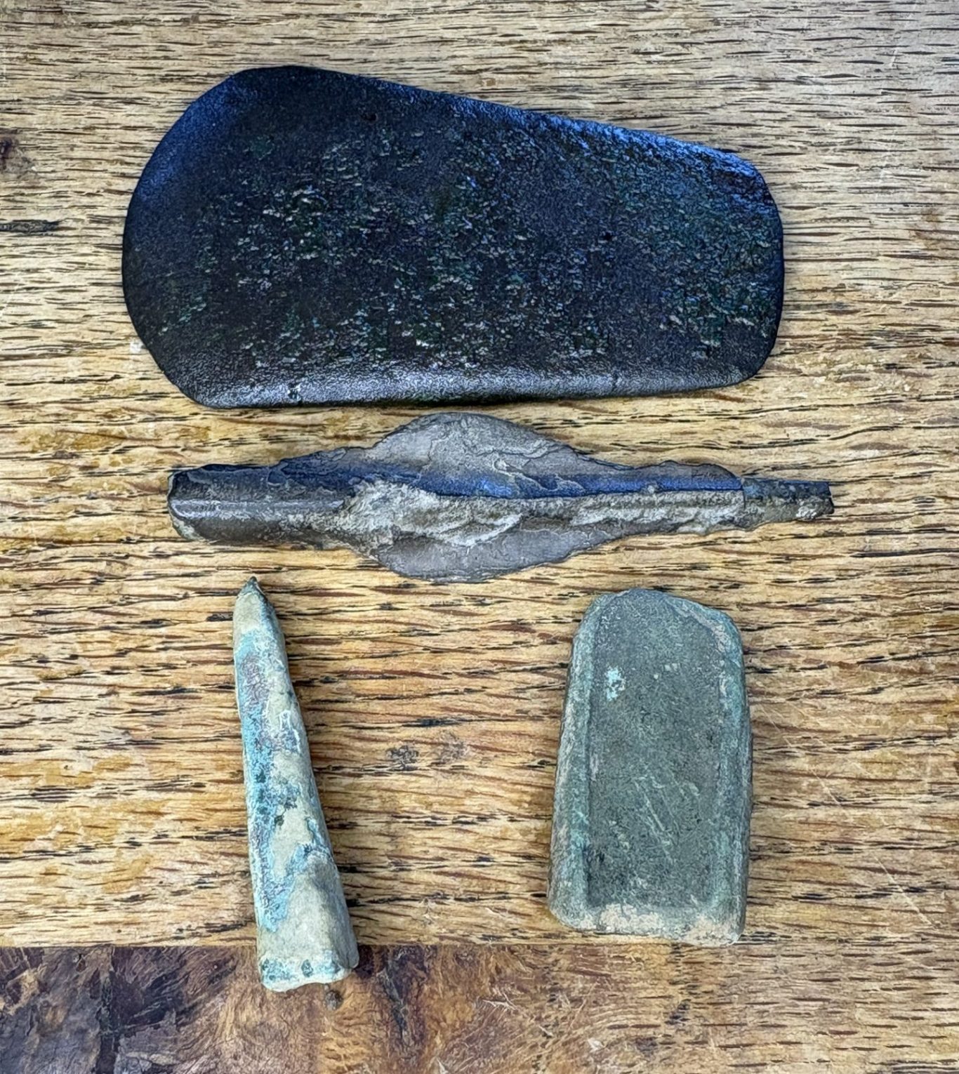 images of my bronze age finds, bronze age copper axe head, spear head, and a piece off a palastive axe.