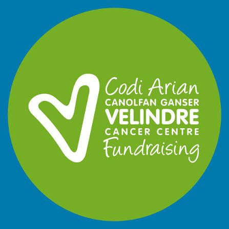 Logo of Velindre Cancer Centre with a heart symbol and text about fundraising.